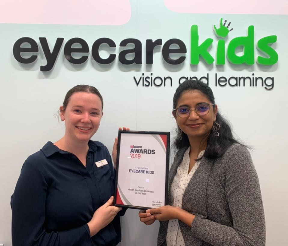 With optometry student Ellie and Eyecare Kids vision therapist Swathi holding the award